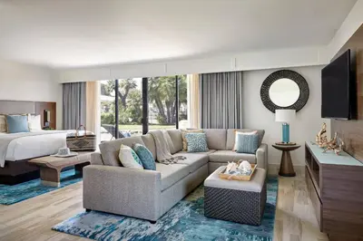 a living room with a couch and a bed at Coronado Island Marriott Resort & Spa in San Diego