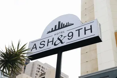 a street sign in front of a building at Hotel Ash&9th in San Diego
