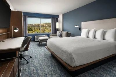 a hotel room with a bed and a desk at Courtyard by Marriott San Diego Mission Valley/Hotel Circle in San Diego