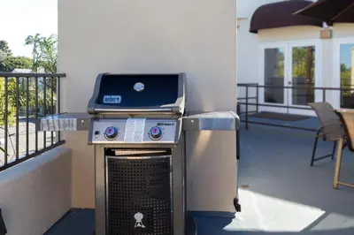 a bbq and a grill on a patio at Coronado Beach Resort in San Diego