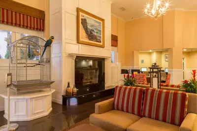 a living room with a couch and a bird cage at Coronado Beach Resort in San Diego