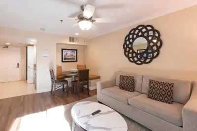 a living room with a couch and a table at Coronado Beach Resort in San Diego