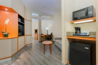 a small room with a kitchen and a living room at Fairfield Inn & Suites Temecula in Temecula