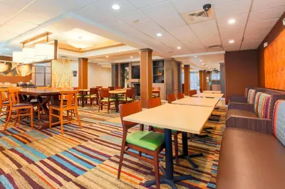 a dining room with tables and chairs in a hotel at Fairfield Inn & Suites Temecula in Temecula