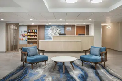a waiting room with two chairs and a table at Fairfield by Marriott Mission Viejo Orange County in Mission Viejo
