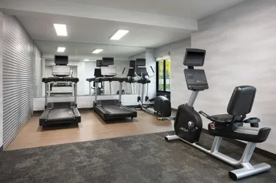 a gym with several treadmills and cardio machines at Fairfield by Marriott Mission Viejo Orange County in Mission Viejo