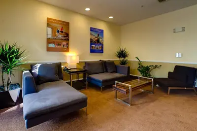 a waiting room with couches and chairs and a table at Club Wyndham Harbour Lights in San Diego
