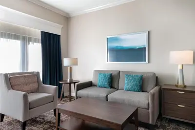 a living room with a couch and chairs and a table at Club Wyndham Harbour Lights in San Diego
