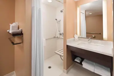 a bathroom with a sink and a shower at TownePlace Suites by Marriott San Diego Downtown in San Diego
