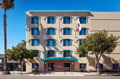 a hotel building with flags in front of it at Empress Hotel La Jolla in San Diego
