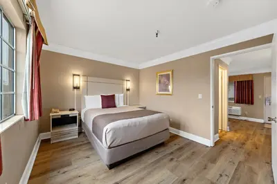 a bedroom with a large bed in a room at Americas Best Value Inn San Clemente Beach in San Clemente