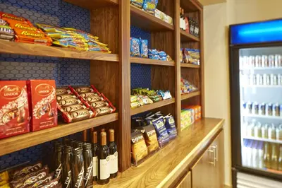 a store with shelves of food and a refrigerator at Hampton Inn San Diego Mission Valley in San Diego