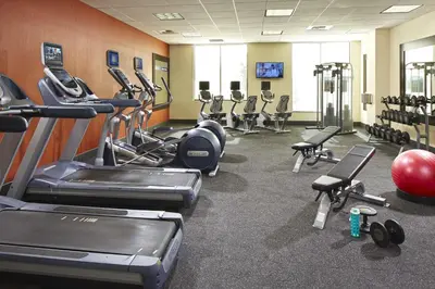 a gym with several treadmills and cardio equipment at Hampton Inn San Diego Mission Valley in San Diego