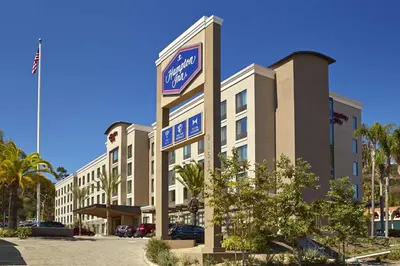 a hotel with a sign on the front of it at Hampton Inn San Diego Mission Valley in San Diego