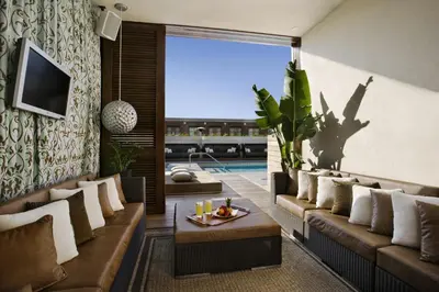 a living room with a couch and a table at Hard Rock Hotel San Diego in San Diego