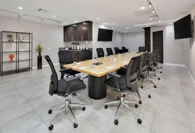 a conference room with a long table and chairs at Hilton Garden Inn San Diego Del Mar in San Diego