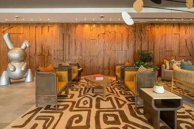 a lobby with couches and a wall of wood at Hilton San Diego Gaslamp Quarter in San Diego