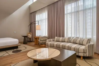 a living room with a couch and a coffee table at Hilton San Diego Gaslamp Quarter in San Diego