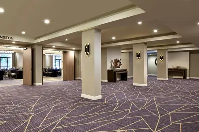 a lobby of a hotel with columns at Hilton San Diego Mission Valley in San Diego