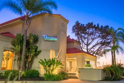 a house with a sign on the side of it at Hilton San Diego Airport/Harbor Island in San Diego