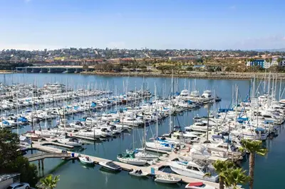 a bunch of boats docked in a harbor at Hilton San Diego Airport/Harbor Island in San Diego
