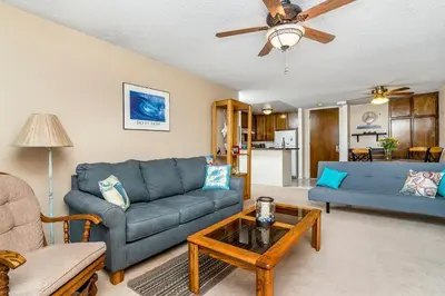 a living room with two couches and a table at Condo in Beachfront Resort B-212 in Oceanside