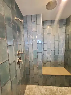 a bathroom with a shower with a glass wall at Sea Horse Resort in San Clemente