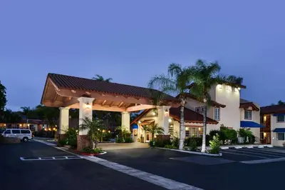 a hotel with a parking lot in front of it at Best Western Capistrano Inn in San Juan Capistrano