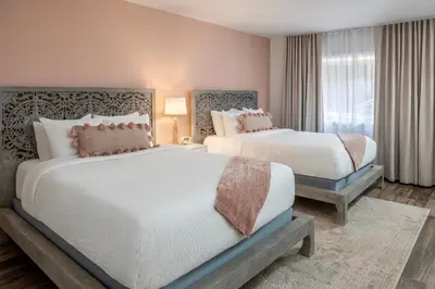 a bedroom with two beds and a window at Cardiff By The Sea Lodge in Encinitas