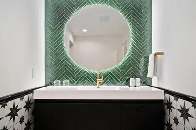 a bathroom with a sink and a mirror at Casablanca Inn in San Clemente