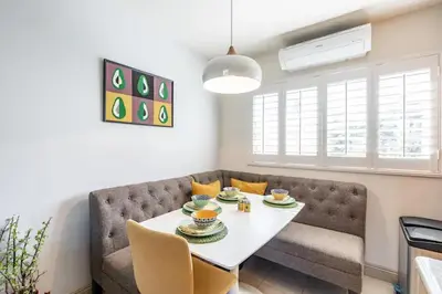 a living room with a table and a couch at Ocean Beach Pier Condo in San Diego
