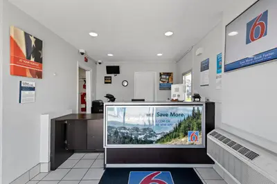 a store with a large tv in a room at Motel 6-San Diego, CA - North in San Diego