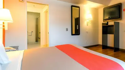 a hotel room with a bed and a television at Motel 6-San Diego, CA - Downtown in San Diego