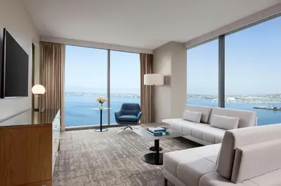 a living room with a couch and a tv at InterContinental San Diego by IHG in San Diego