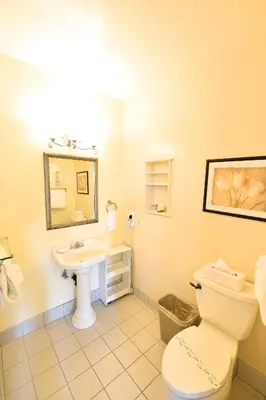 a bathroom with a toilet and a sink at Crown City Inn Coronado in San Diego