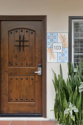 a wooden door in front of a house at Crown City Inn Coronado in San Diego