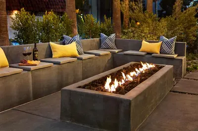 a fire pit in the middle of a patio at Pacific View Inn in San Diego