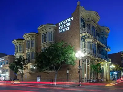 a building with a sign on the side of it at Horton Grand Hotel in San Diego