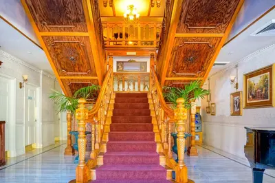 a spiral staircase in a building with wooden ceilings at Horton Grand Hotel in San Diego