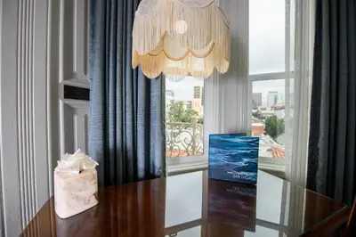 a table with a bag on it next to a window at Horton Grand Hotel in San Diego