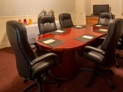 a conference table with four chairs around it at Horton Grand Hotel in San Diego
