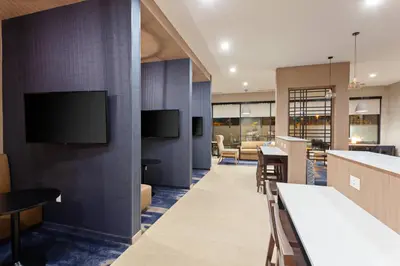 a lobby with a bar with a tv on the wall at TownePlace Suites by Marriott San Diego Central in San Diego