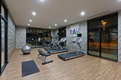 a gym with several exercise equipment in a room at TownePlace Suites by Marriott San Diego Central in San Diego
