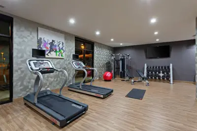 a gym with treadmills and exercise equipment in a room at TownePlace Suites by Marriott San Diego Central in San Diego