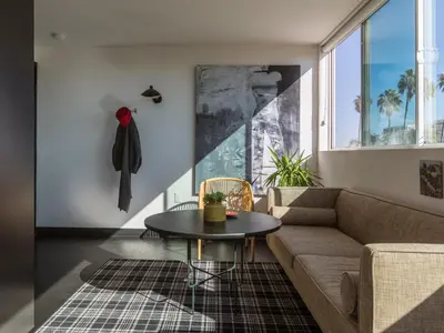 a living room with a couch and a table at Abpopa Hillcrest in San Diego