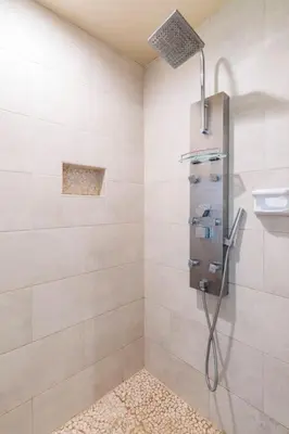 a shower stall in a bathroom with a shower at The Little Pumpkin Guest House in San Diego