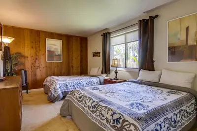 a bedroom with two beds and a window at PACIFIC BEACH MANSION in San Diego