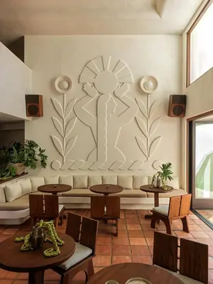 a living room with a couch and tables at Casa Loma Beach Hotel in Laguna Beach