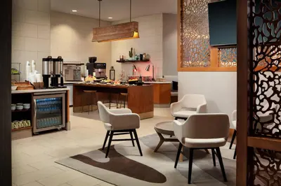 a kitchen with chairs and a table and a counter at San Diego Marriott La Jolla in San Diego