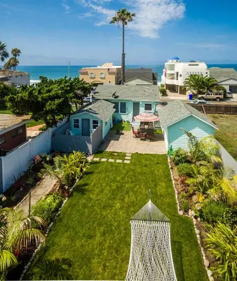 an aerial view of a yard with houses and the ocean at Pacific Bungalow in Oceanside with Backyard & Tiny House in Oceanside